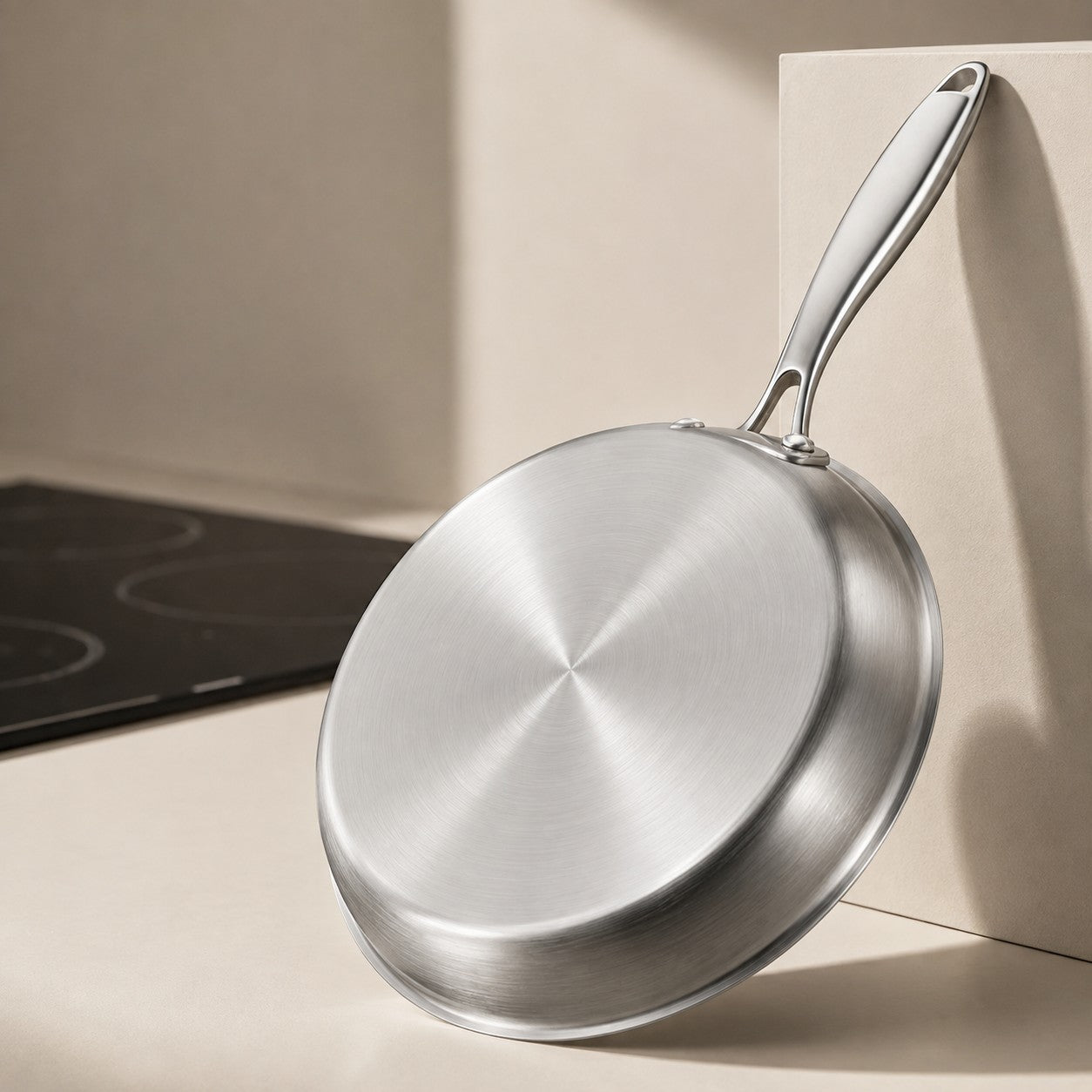 The flat brushed base of The Sunday Pan, suitable for induction hobs